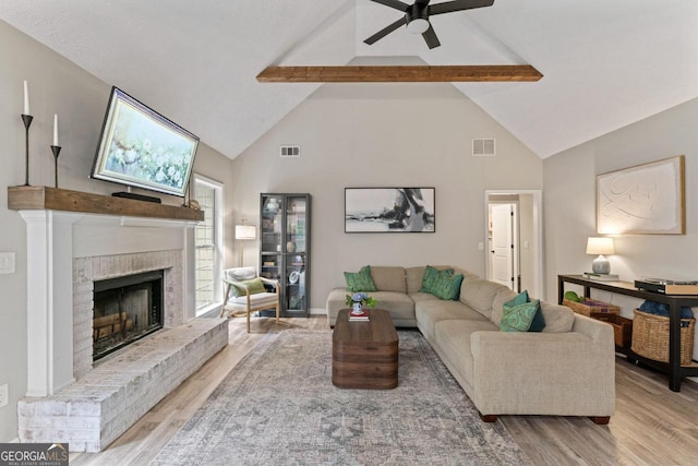 15 Stonewood Way, Sharpsburg, GA 30277 - living room with wood finished floors, beam ceiling, a fireplace, high vaulted ceiling, and ceiling fan