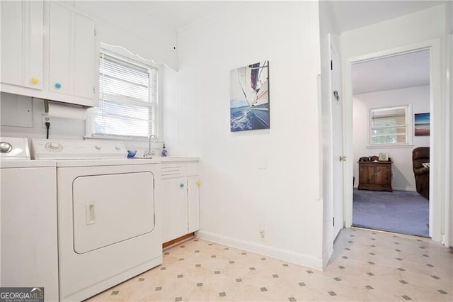 6381 Lakeview Dr, Buford, GA 30518 - laundry area featuring cabinet space, light floors, plenty of natural light, and washing machine and dryer