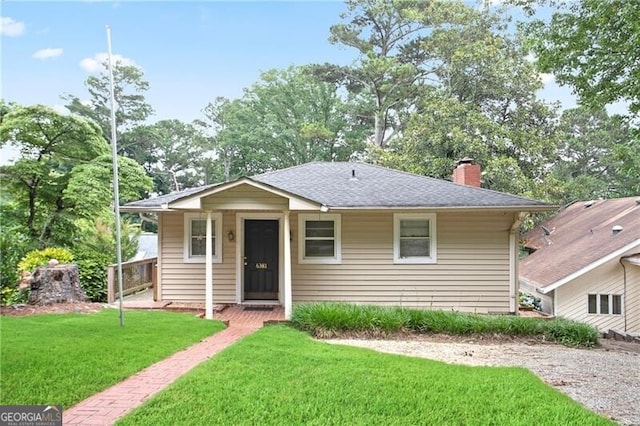 6381 Lakeview Dr, Buford, GA 30518 - bungalow-style house with a chimney, a front yard, and roof with shingles