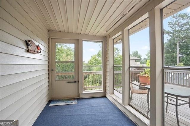 6381 Lakeview Dr, Buford, GA 30518 - doorway to outside featuring carpet and wooden walls