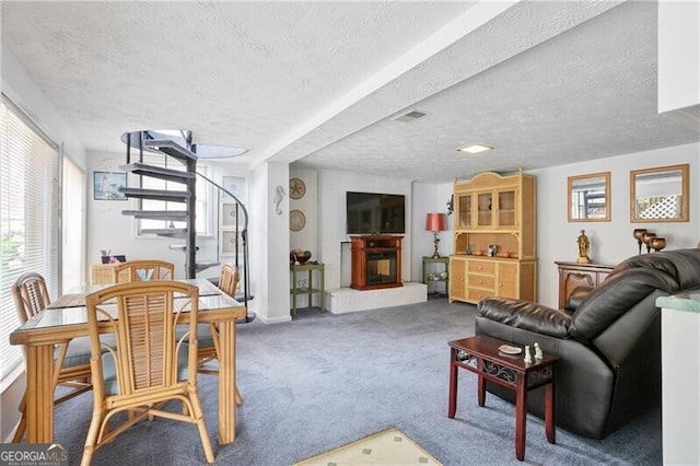6381 Lakeview Dr, Buford, GA 30518 - carpeted living area featuring a fireplace with raised hearth and a textured ceiling
