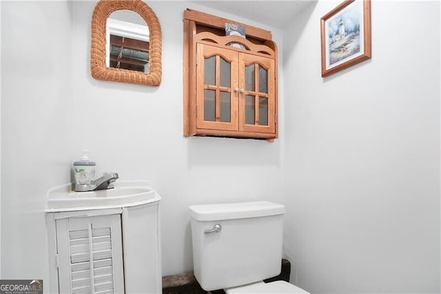 6381 Lakeview Dr, Buford, GA 30518 - half bathroom featuring vanity and toilet