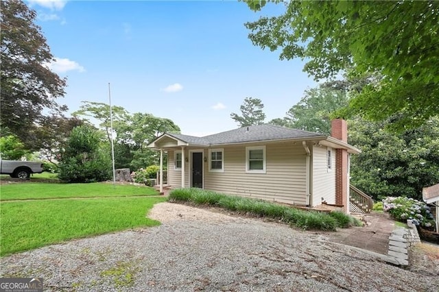 6381 Lakeview Dr, Buford, GA 30518 - view of front of house featuring a chimney and a front yard