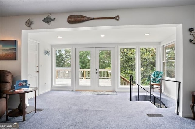 6381 Lakeview Dr, Buford, GA 30518 - living area featuring carpet, french doors, healthy amount of natural light, recessed lighting, and an upstairs landing