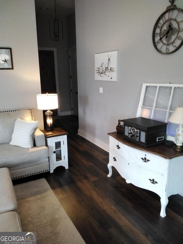 211 Barnyard Way, Perry, GA 31069 - living area with dark wood-style floors and baseboards
