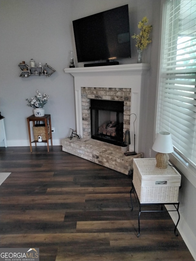 211 Barnyard Way, Perry, GA 31069 - living area featuring wood finished floors and a stone fireplace