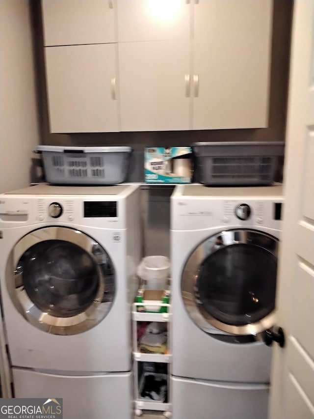 211 Barnyard Way, Perry, GA 31069 - laundry room with cabinet space and washer and clothes dryer