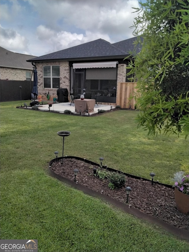 211 Barnyard Way, Perry, GA 31069 - rear view of property with brick siding, a patio area, and a shingled roof