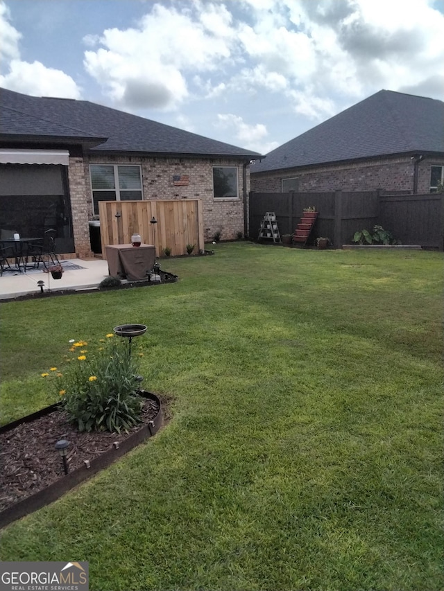 211 Barnyard Way, Perry, GA 31069 - view of yard featuring a patio