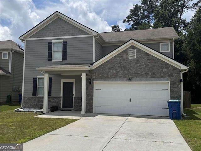 7637 Rudder Cir, Fairburn, GA 30213 - craftsman-style home with stone siding, driveway, a front yard, and an attached garage