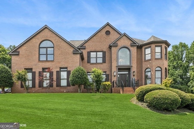3835 Hickory Branch Trl, Suwanee, GA 30024 - view of front facade featuring a front yard and brick siding