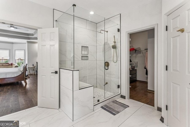 3835 Hickory Branch Trl, Suwanee, GA 30024 - ensuite bathroom featuring a shower stall, a walk in closet, ornamental molding, and recessed lighting