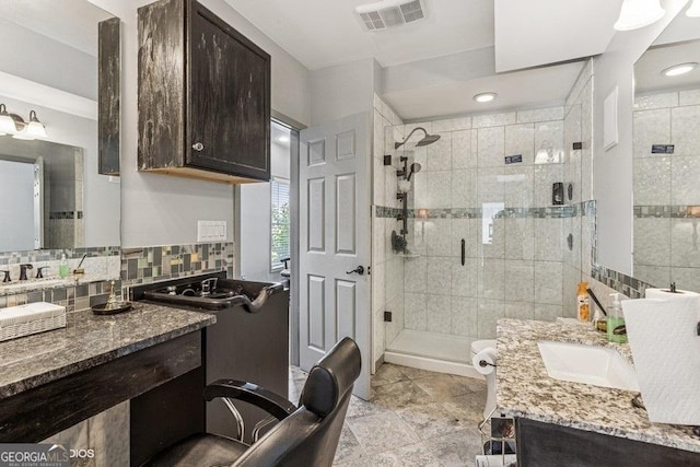 3835 Hickory Branch Trl, Suwanee, GA 30024 - full bathroom featuring vanity, a shower stall, and backsplash