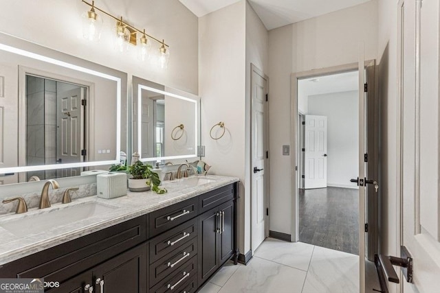 3835 Hickory Branch Trl, Suwanee, GA 30024 - full bathroom with double vanity and baseboards