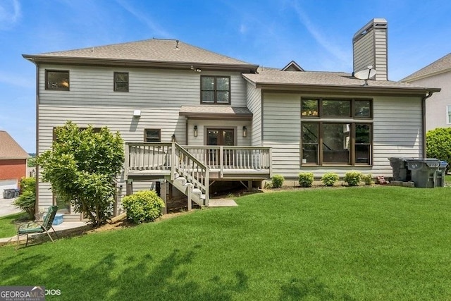 3835 Hickory Branch Trl, Suwanee, GA 30024 - rear view of property with a wooden deck, a yard, a chimney, and a shingled roof