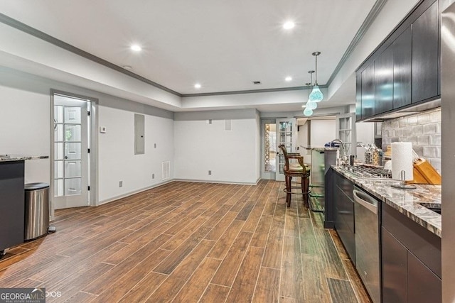 3835 Hickory Branch Trl, Suwanee, GA 30024 - kitchen with wood finished floors, appliances with stainless steel finishes, light stone countertops, ornamental molding, and a tray ceiling