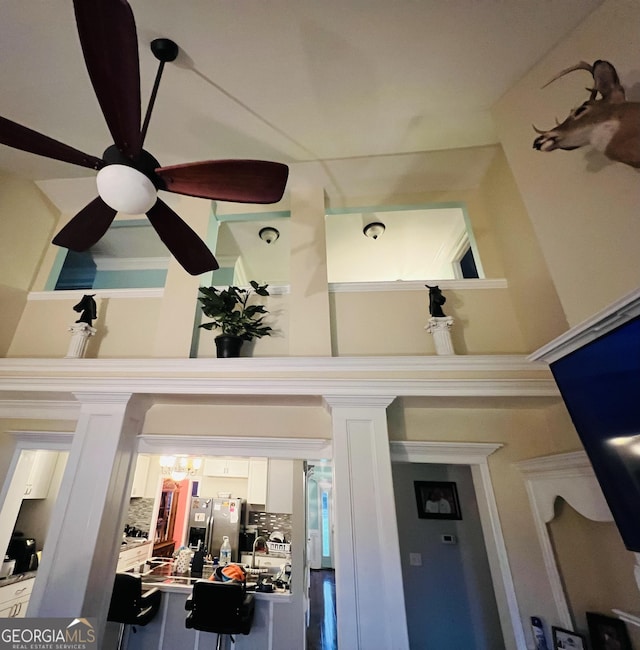 2481 Islands Hwy, Midway, GA 31320 - detailed view of stainless steel fridge and ceiling fan