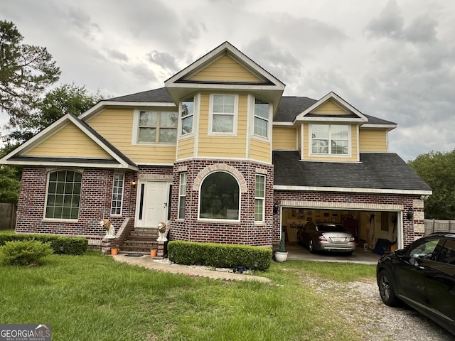 2481 Islands Hwy, Midway, GA 31320 - view of front facade featuring dirt driveway, brick siding, a front yard, and an attached garage