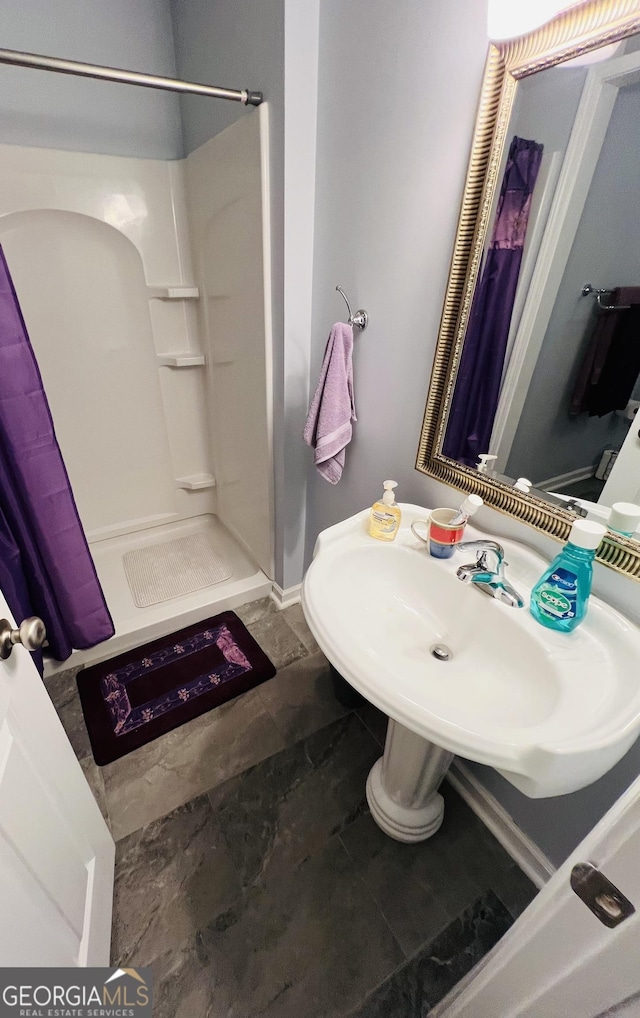 2481 Islands Hwy, Midway, GA 31320 - full bathroom with a shower stall and tile patterned flooring