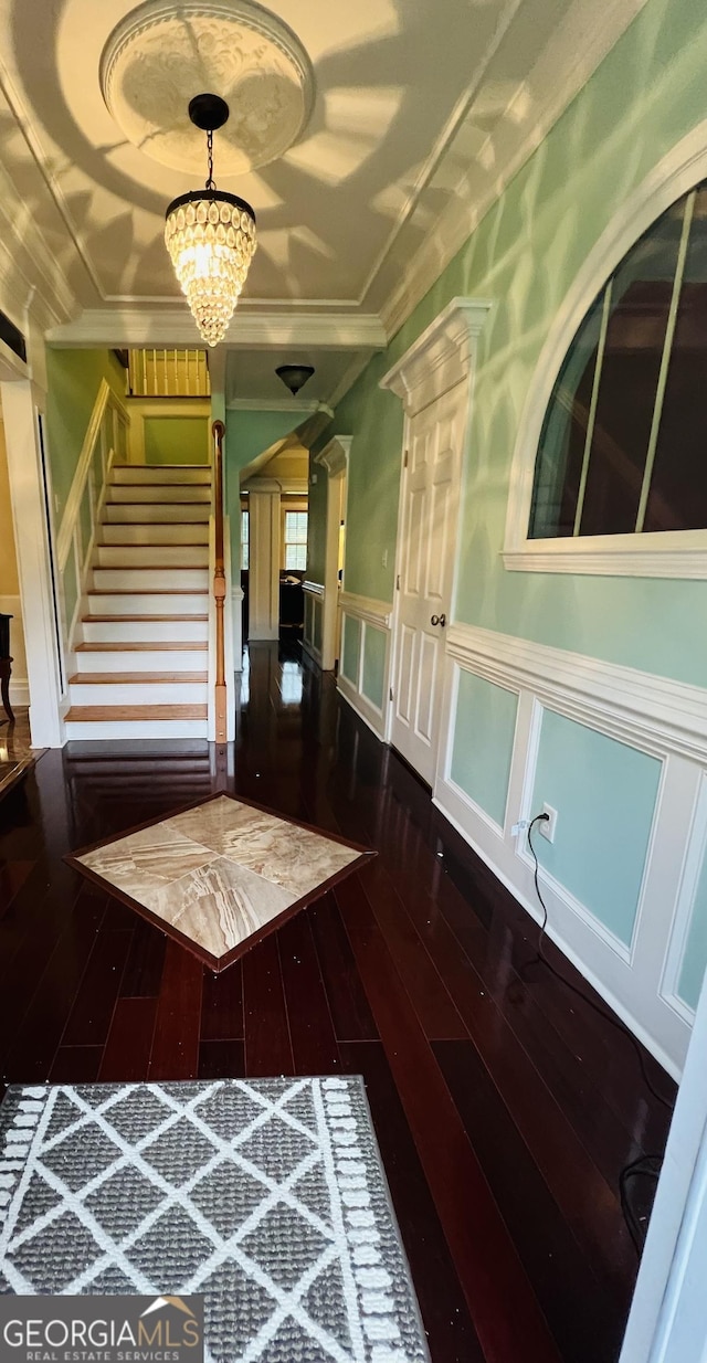 2481 Islands Hwy, Midway, GA 31320 - foyer featuring hardwood / wood-style flooring, stairs, a wainscoted wall, crown molding, and ornate columns