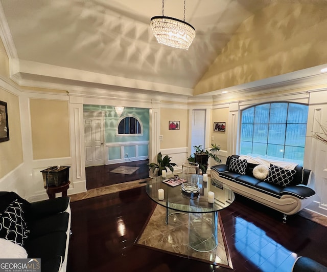 2481 Islands Hwy, Midway, GA 31320 - living area with a decorative wall, lofted ceiling, wood finished floors, and a chandelier