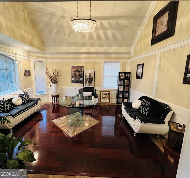 2481 Islands Hwy, Midway, GA 31320 - living area with vaulted ceiling, a decorative wall, hardwood / wood-style flooring, ornamental molding, and a chandelier