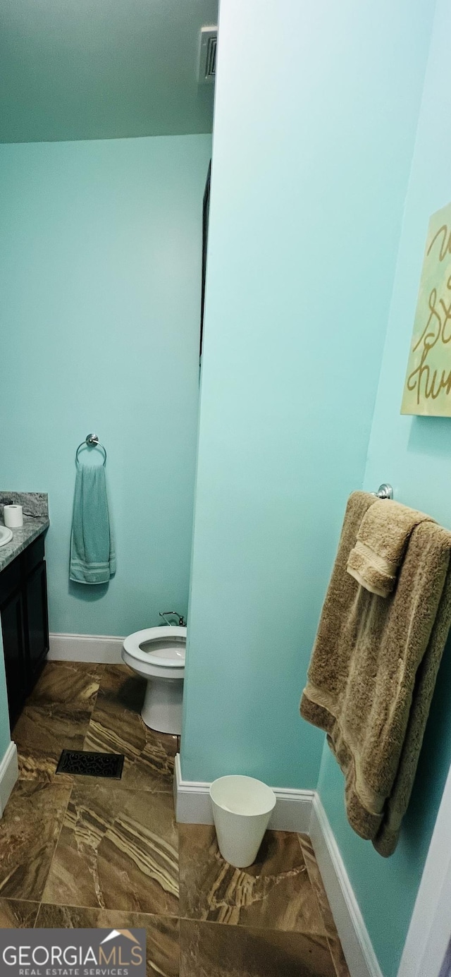 2481 Islands Hwy, Midway, GA 31320 - bathroom with toilet and vanity