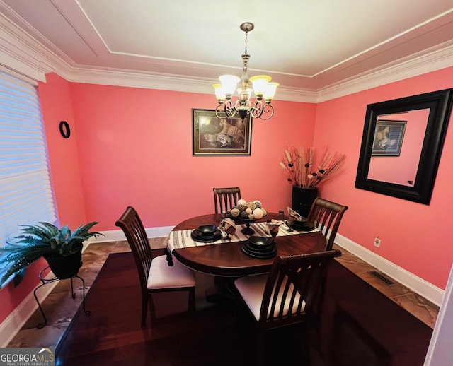 2481 Islands Hwy, Midway, GA 31320 - dining area with a chandelier, ornamental molding, and wood finished floors