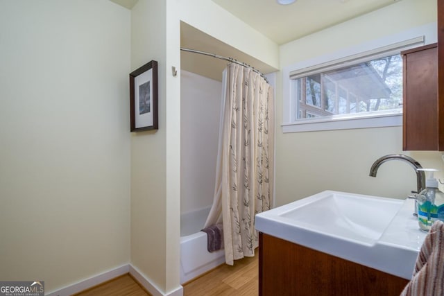 40 Pond Path, Ellijay, GA 30536 - full bath with wood finished floors, vanity, and shower / bath combo with shower curtain
