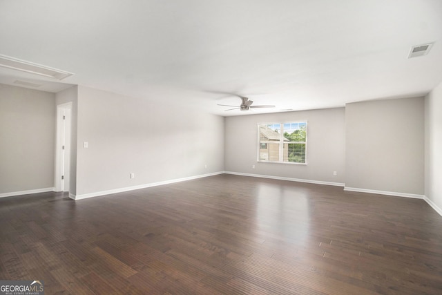 8041 Louis Dr, Locust Grove, GA 30248 - spare room with ceiling fan, dark wood-type flooring, and attic access