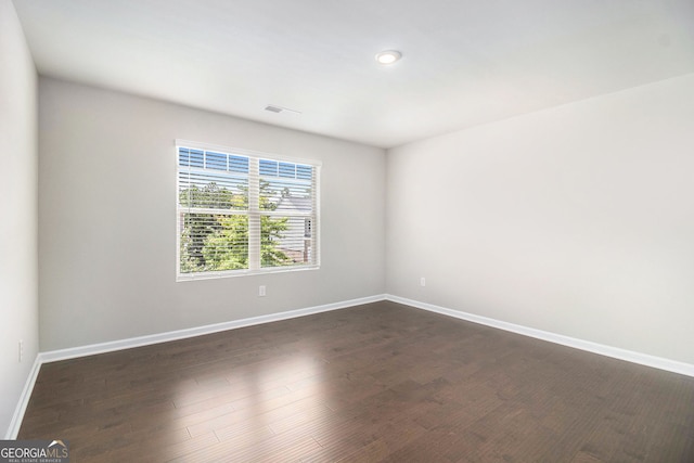 8041 Louis Dr, Locust Grove, GA 30248 - spare room featuring dark wood-type flooring and recessed lighting