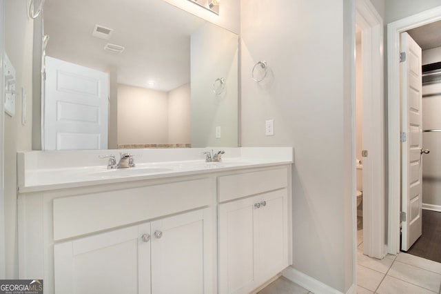 8041 Louis Dr, Locust Grove, GA 30248 - full bathroom with double vanity and tile patterned flooring