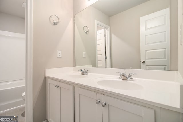 8041 Louis Dr, Locust Grove, GA 30248 - bathroom with double vanity and toilet