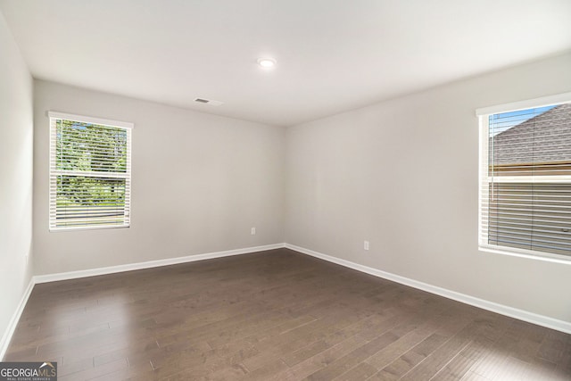 8041 Louis Dr, Locust Grove, GA 30248 - empty room with dark wood finished floors and recessed lighting