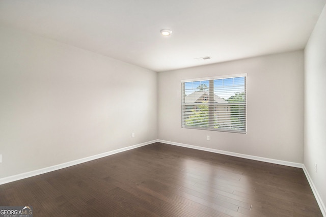 8041 Louis Dr, Locust Grove, GA 30248 - spare room featuring baseboards and dark wood finished floors