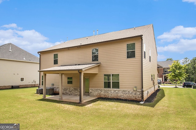 8041 Louis Dr, Locust Grove, GA 30248 - back of property with a patio area and a yard