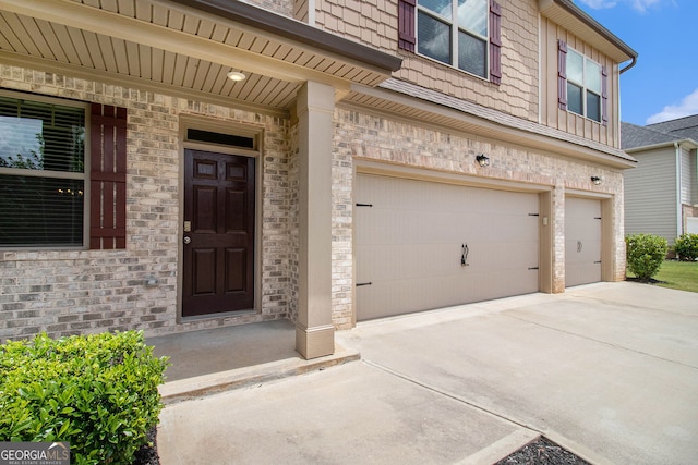 8041 Louis Dr, Locust Grove, GA 30248 - entrance to property featuring a garage and concrete driveway