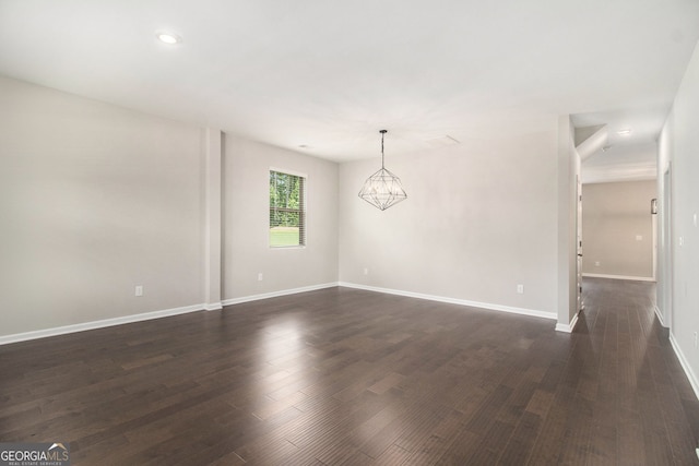 8041 Louis Dr, Locust Grove, GA 30248 - empty room with dark wood-style floors, a chandelier, and recessed lighting