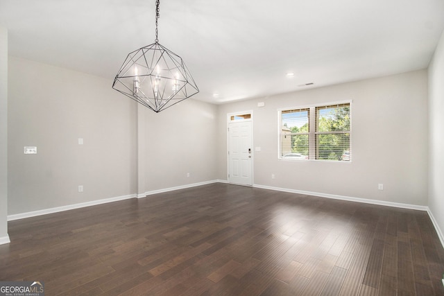 8041 Louis Dr, Locust Grove, GA 30248 - empty room featuring a chandelier, dark wood finished floors, and recessed lighting