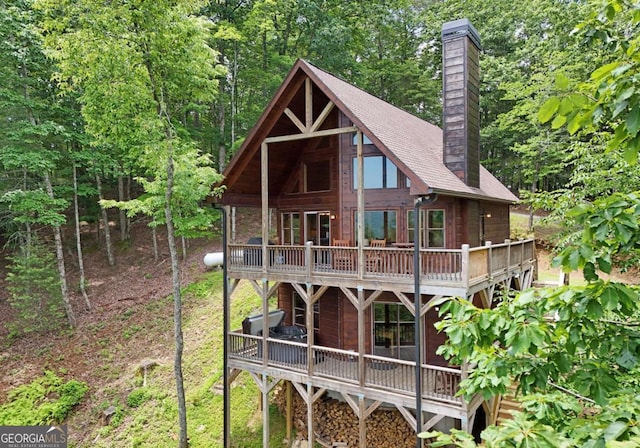73 Rosiey Ln Unit 356, Blue Ridge, GA 30513 - back of property with a chimney, a deck, and a shingled roof