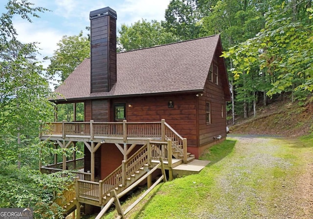73 Rosiey Ln Unit 356, Blue Ridge, GA 30513 - rear view of house featuring stairway, a chimney, and roof with shingles