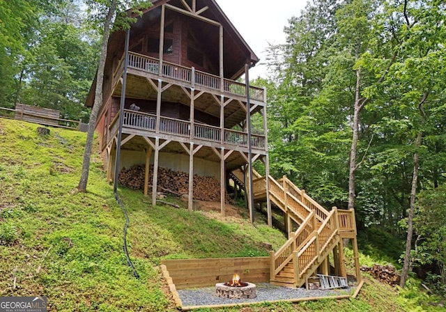 73 Rosiey Ln Unit 356, Blue Ridge, GA 30513 - back of house featuring a fire pit, stairway, and a wooden deck