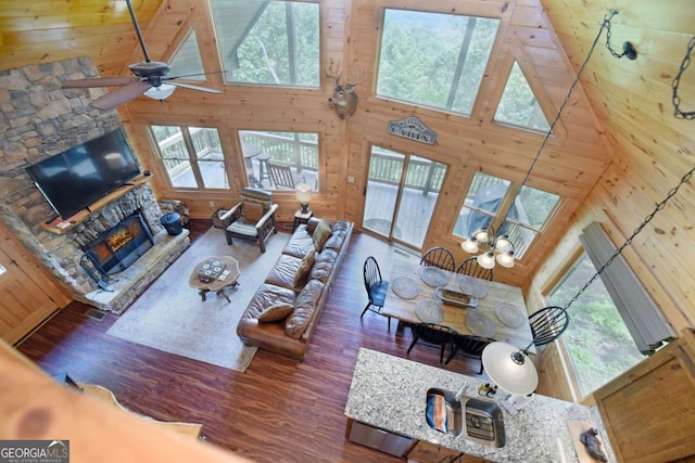 73 Rosiey Ln Unit 356, Blue Ridge, GA 30513 - living room featuring high vaulted ceiling, healthy amount of natural light, wood finished floors, a fireplace, and wood walls