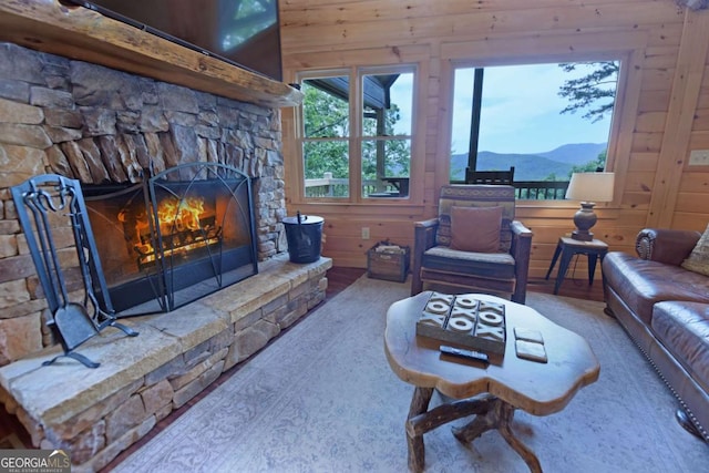 73 Rosiey Ln Unit 356, Blue Ridge, GA 30513 - living area with a fireplace, wood walls, and a mountain view