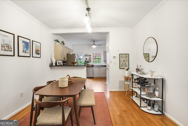 3675 Peachtree Rd NE Apt 24, Atlanta, GA 30319 - dining space with light wood finished floors, a ceiling fan, and ornamental molding