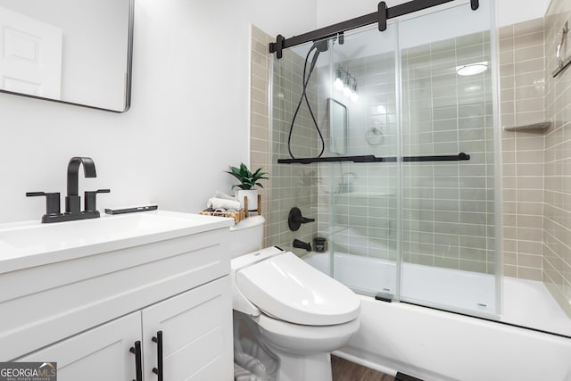 3675 Peachtree Rd NE Apt 24, Atlanta, GA 30319 - bathroom featuring vanity, enclosed tub / shower combo, and wood finished floors
