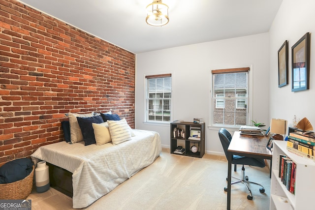 3675 Peachtree Rd NE Apt 24, Atlanta, GA 30319 - bedroom featuring brick wall, an office area, and carpet flooring