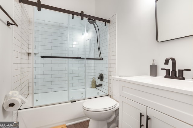 3675 Peachtree Rd NE Apt 24, Atlanta, GA 30319 - bathroom with vanity, shower / bath combination with glass door, and wood finished floors