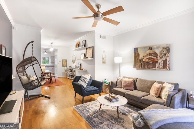 3675 Peachtree Rd NE Apt 24, Atlanta, GA 30319 - living area featuring ceiling fan, wood finished floors, and crown molding