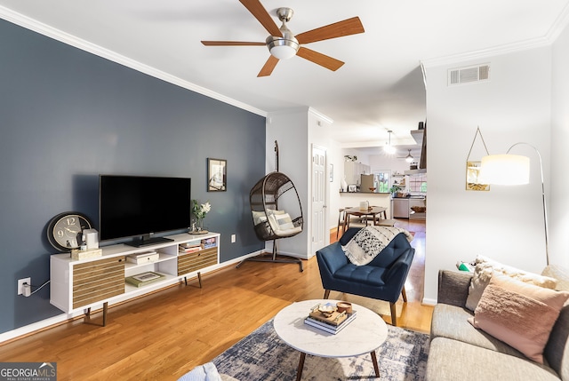 3675 Peachtree Rd NE Apt 24, Atlanta, GA 30319 - living room featuring ceiling fan, wood finished floors, and crown molding